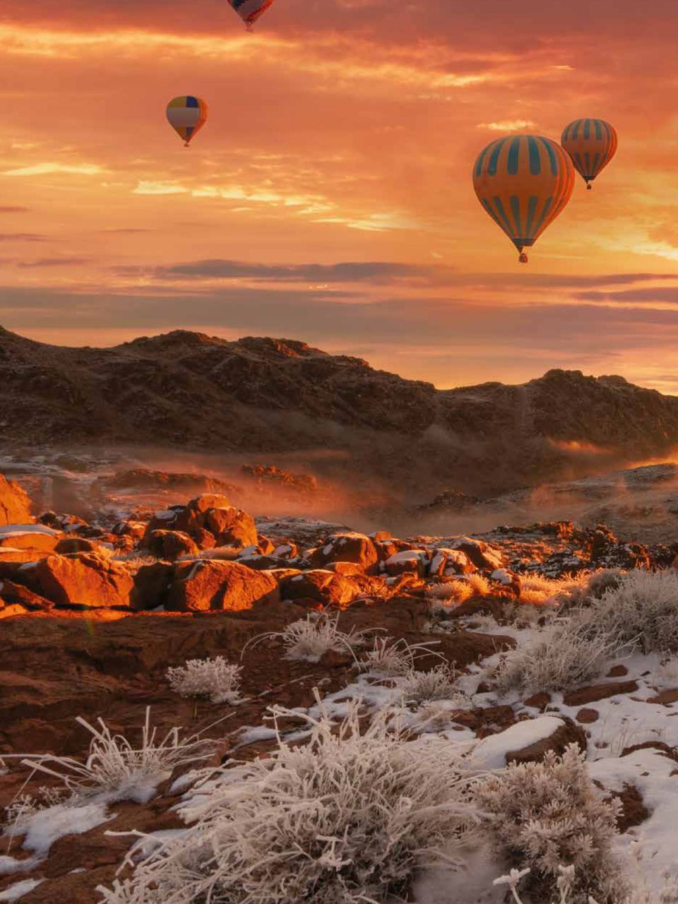 Hot-air balloons over the frozen canyon